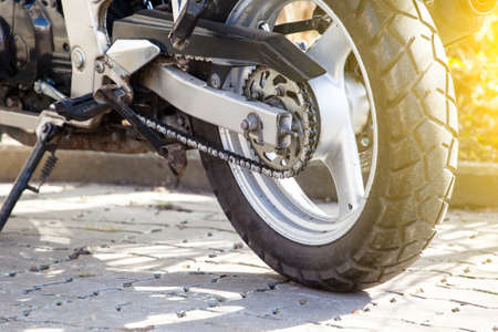 chain and rear wheel of a motorcycle, tonedの写真素材