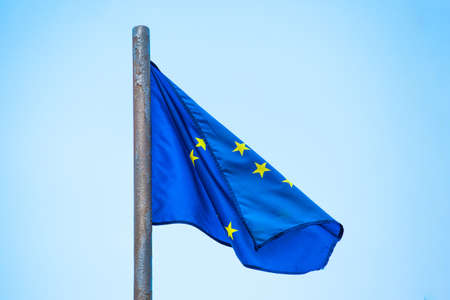 flag of the European Union on the flagpole against the sky