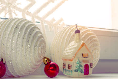 Christmas scene with Christmas tree decorations and decorations on the windowsill, tonedの写真素材