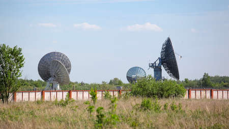 huge satellite dishes in the fieldの写真素材