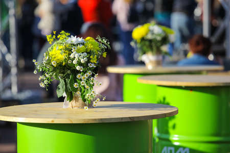 a bouquet of flowers in a pot on a table