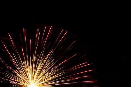 bright, colorful, multi-colored bursts of fireworks on the night skyの写真素材