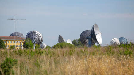huge satellite dishes in the fieldの写真素材