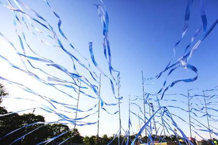 festival ribbons and flags fluttering downwindの写真素材
