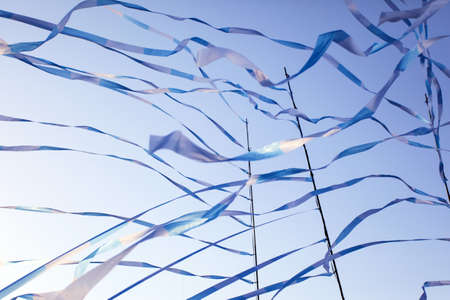 festival ribbons and flags fluttering downwindの写真素材