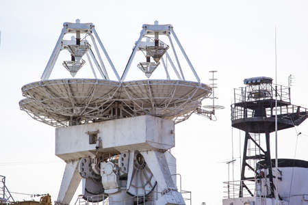 large radar dishes on the deck of the ship