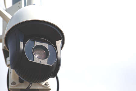 modern street moving surveillance camera, retro toned