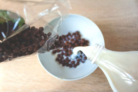 chocolate cornflakes with milk, tonedの写真素材