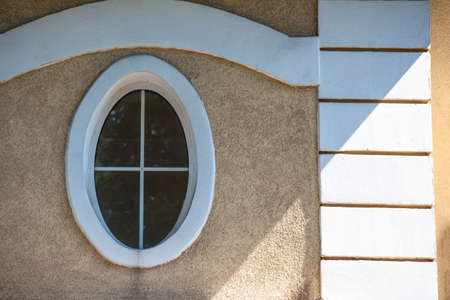cozy oval window in the old wallのeditorial素材