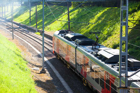 modern electric train travels by railのeditorial素材