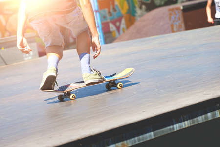 young guy skating in sunny weather, tonedのeditorial素材