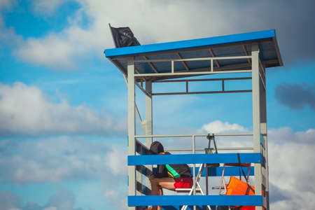 lifeguard on a tower against the blue skyの写真素材