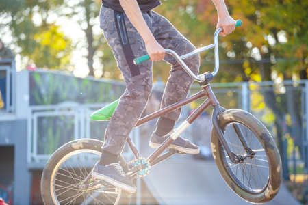 young athlete makes an extreme bike jump on a rampの写真素材
