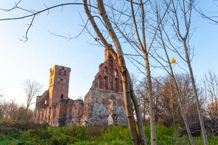 abandoned ruins of an old red brick medieval churchの写真素材