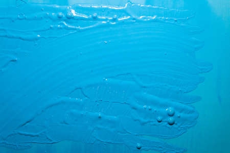 bright blue surface with paint strokes, background, texture