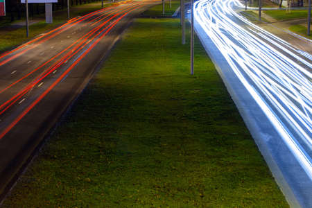 traces of light from the headlights of cars on the night street on long exposure