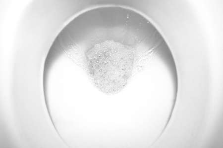 top view of the flushing water in the toiletの写真素材