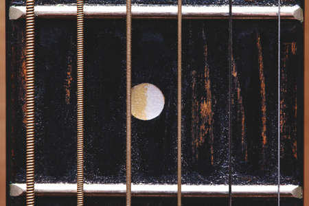 old shabby guitar neck close-upの写真素材