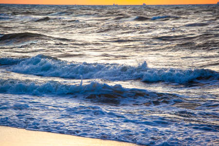 sea surface with waves during sunset...