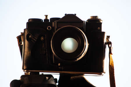 old film camera in a case on a tripodの写真素材