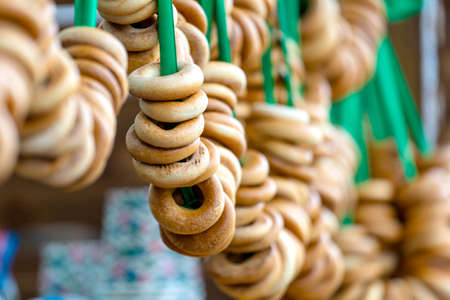 knitted bagels on a rope in the market