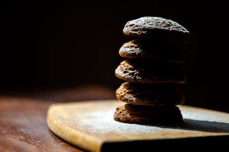 stack of oatmeal cookies on a wooden board