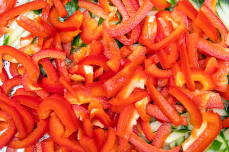 chopped red bell pepper and cucumbers, backgroundの写真素材