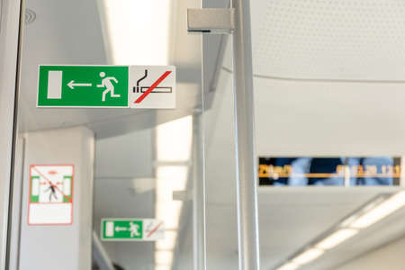 exit sign and no smoking sign in a train carの写真素材
