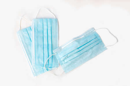 blue medical disposable masks on white surfaceの写真素材