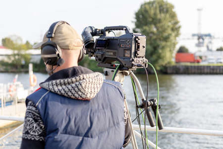 operator with a large professional television camera