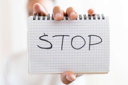 shows a sheet of paper with the inscription STOPの写真素材