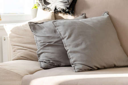 pillows stacked on the couchの写真素材