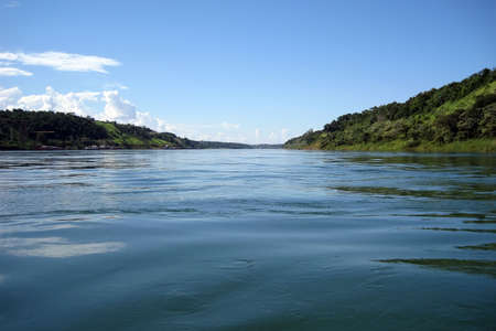 Iguazu River dividing Argentina and Brazil and flowing from Iguazu Fallsの写真素材