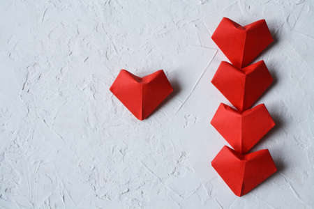 Red hearts on a textured white white background. Valentine day.の写真素材
