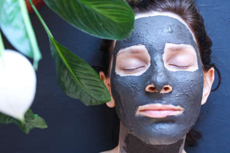 Portrait of young woman while facial cosmetic procedure