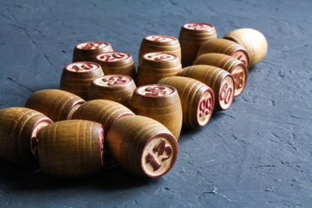 Vintage Lotto barrels are arranged in random order on a dark surface.の写真素材
