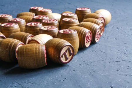 Vintage Lotto barrels are arranged in random order on a dark surface.の写真素材