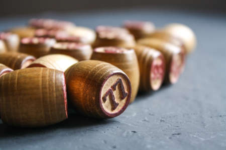 Vintage Lotto barrels are arranged in random order on a dark surface.の写真素材