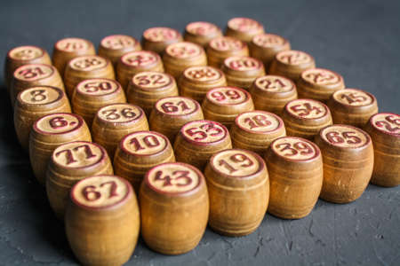 Vintage Lotto barrels are arranged in random order on a dark surface.の写真素材