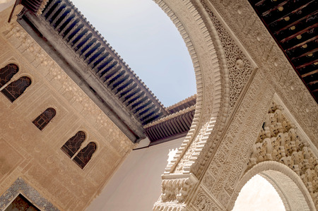 Columns and tower of the Alhambra Nasrid monumentのeditorial素材
