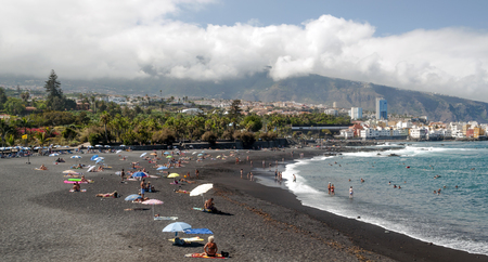 People in beach garden on the island of Tenerifeの写真素材