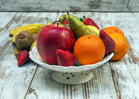 Fruits surrounded by rustic backgroundの写真素材