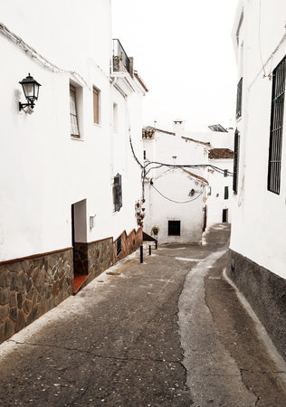 Street of white walls in a village of Andalusia called Frigilianaの写真素材