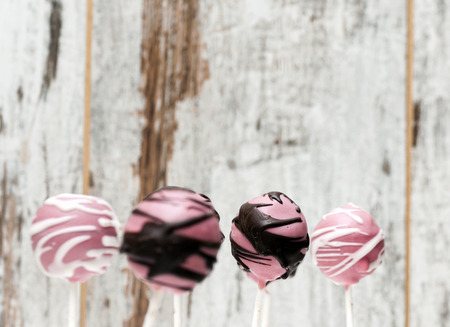 Lollipop cupcake surrounded by rustic backgroundの写真素材