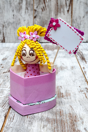 Dolls surrounded by rustic backgroundの写真素材