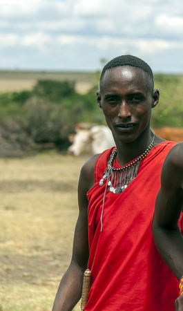 MASAI MARA,KENYA-MAY 14:portrait on an African man of Masai Mara tribe village smiling to camera e,review of daily life of local people,near Masai Mara National Parkのeditorial素材