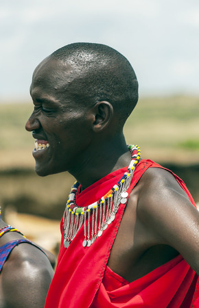MASAI MARA,KENYA-MAY 14:portrait on an African man of Masai Mara tribe village smiling to camera e,review of daily life of local people,near Masai Mara National Parkのeditorial素材