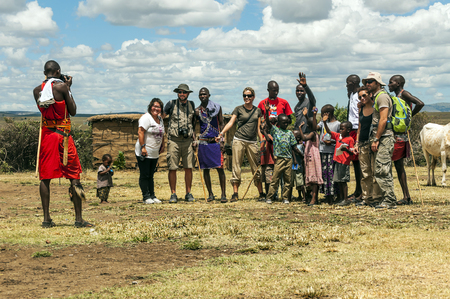 MASAI MARA, KENYA - MAY 2014. Unidentified Masai warriors participate in competitions in traditional high jump as part of the cultural ceremonies and dances in the Masai Mara National Parkのeditorial素材