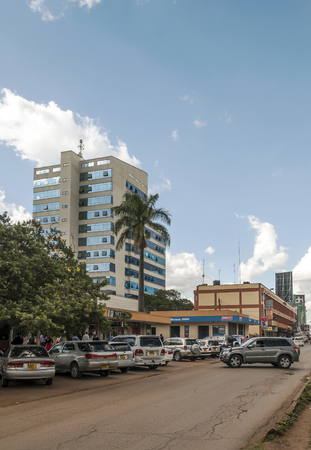 NAIROBI, KENYA - MAY 2014.Street scene in Nairobi. Cars and people in street. In background there are buildings, shops and advertising billboards.のeditorial素材