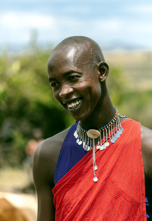 MASAI MARA,KENYA-MAY 14:portrait on an African man of Masai Mara tribe village smiling to camera e,review of daily life of local people,near Masai Mara National Parkのeditorial素材